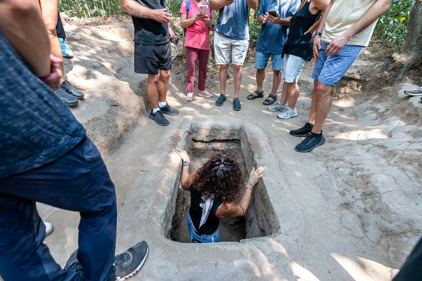 https://abtravel.vn/wp-content/uploads/2025/09/cu-chi-tunnels-walk-and-crouch-underground-paths.jpg